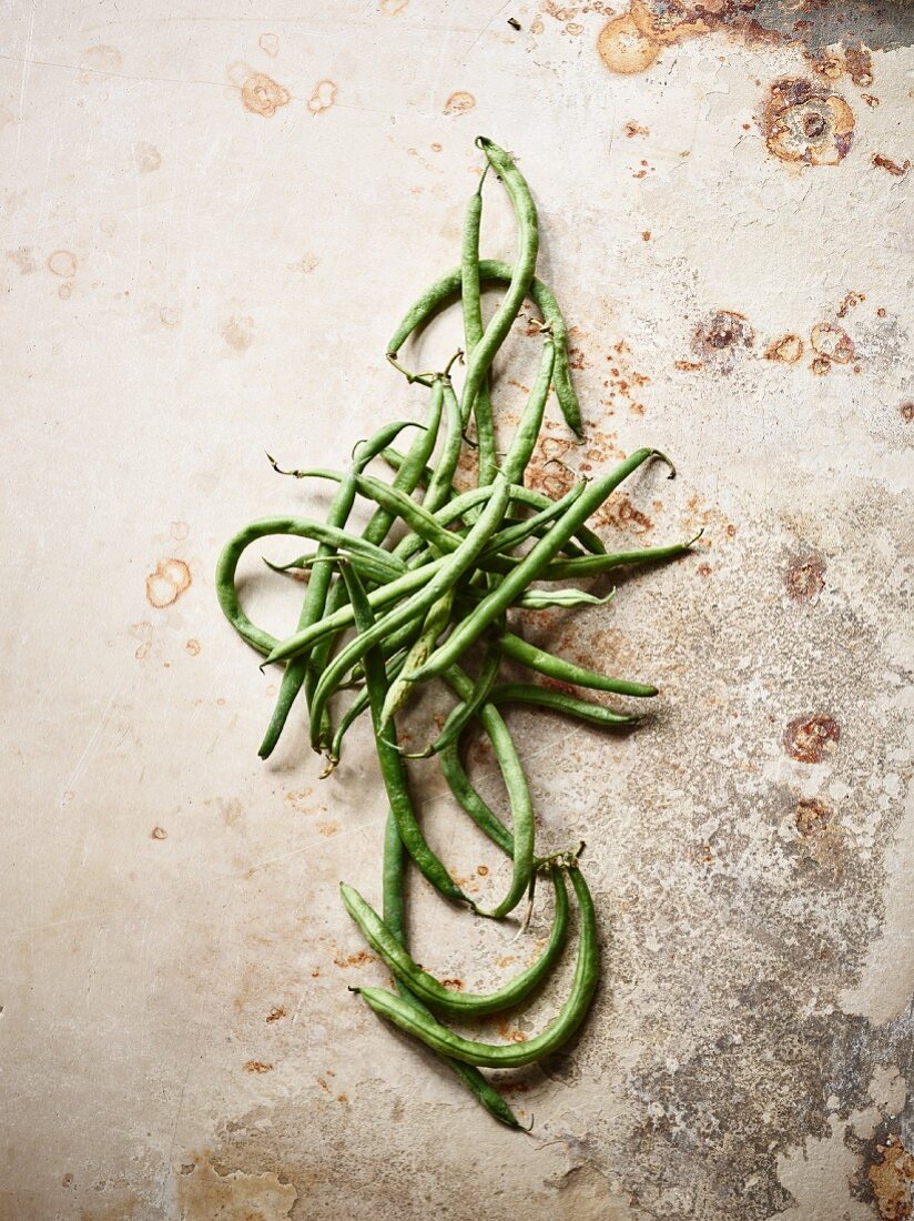 Green beans on a vintage background