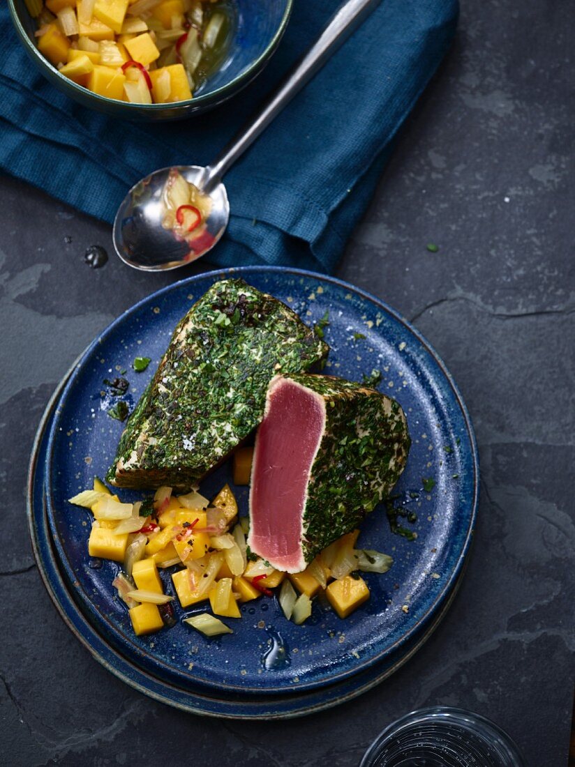 Tuna steaks with a herb crust and mango salad