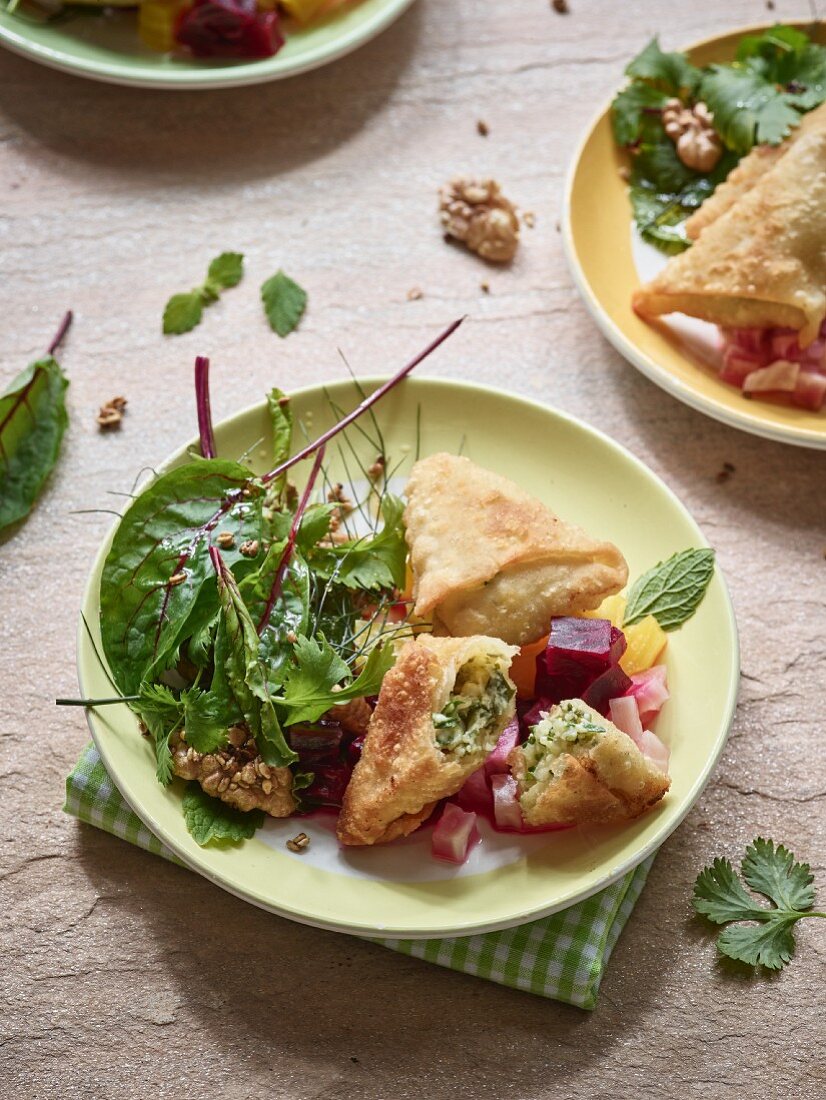 Austrian Schlutzkrapfen with a mixed leaf salad and colourful beet compote
