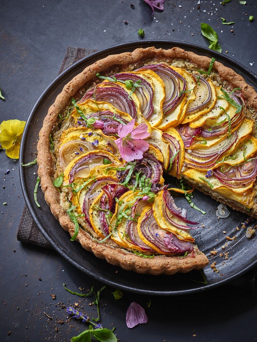 A courgette tart with red onions
