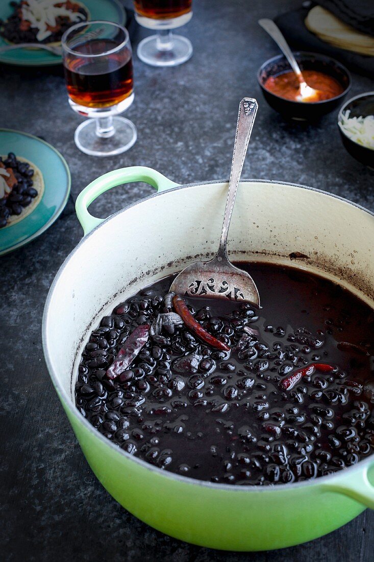 A pot of homemade black beans with chilis for tortillas (Mexico)