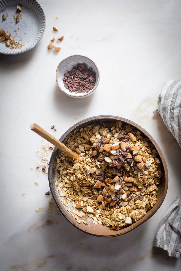 Preparation of granola mixture in a mable backdrop on top view