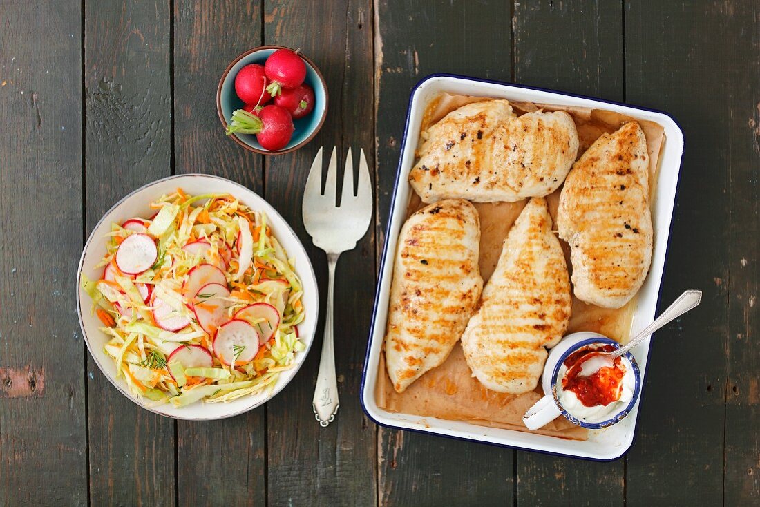 Grilled chicken breast with carrot and radish coleslaw