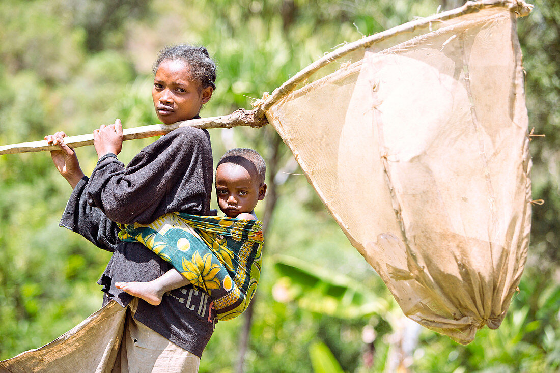 Woman holding a giant fishing net, Madagascar