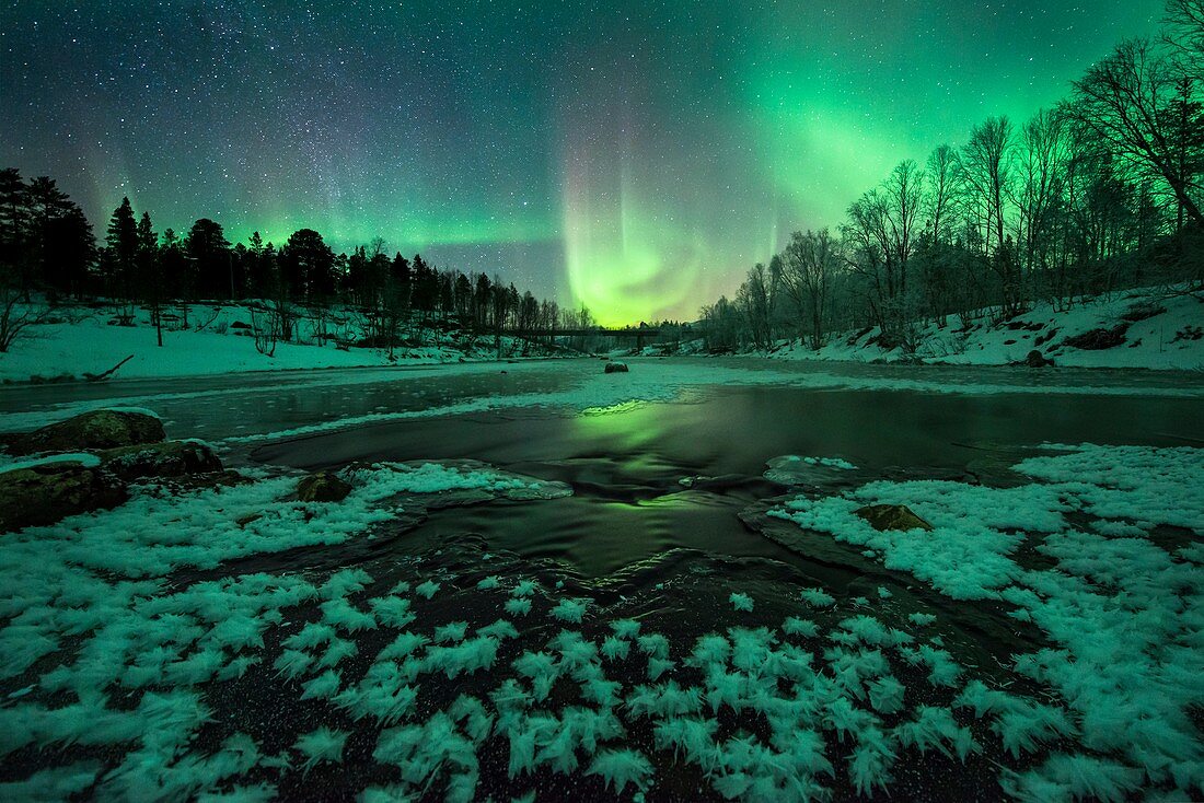Aurora borealis over a river