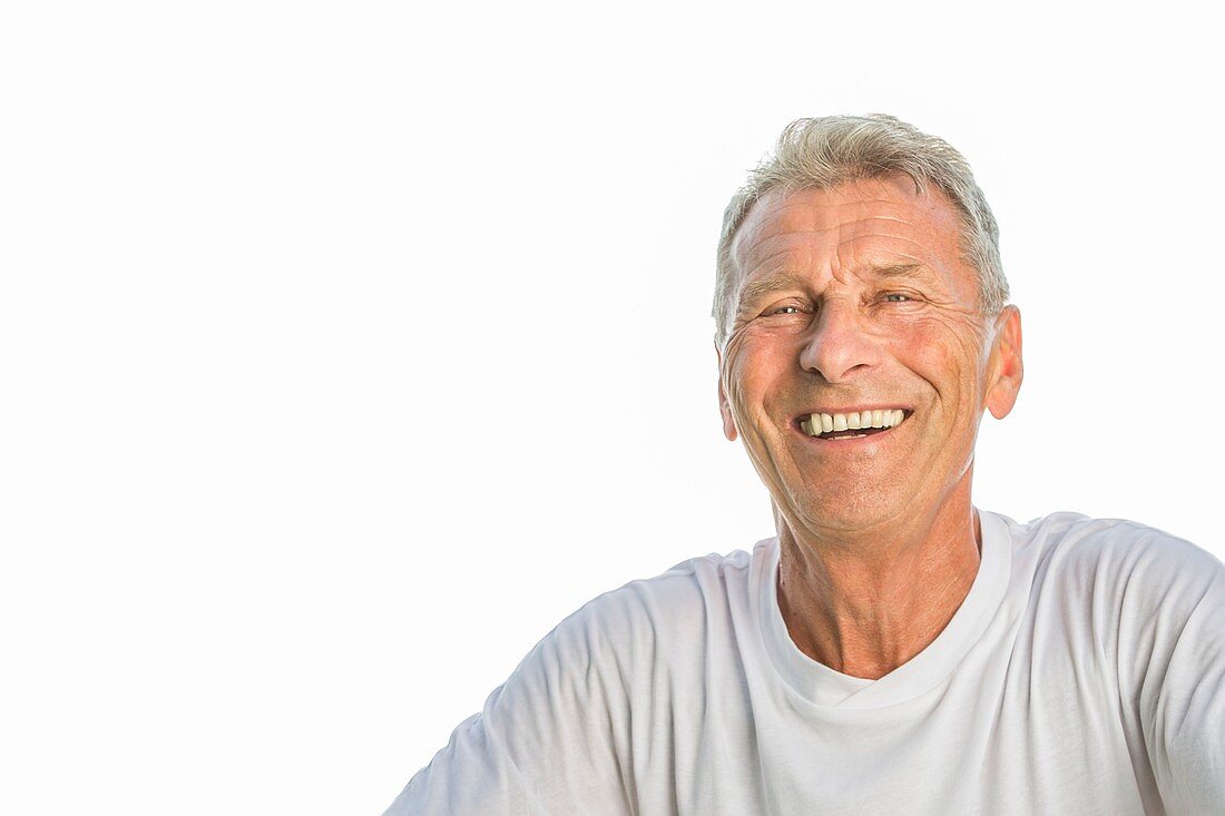 Man smiling against white background, portrait