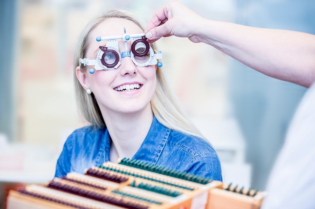 Optometrist examining woman's vision