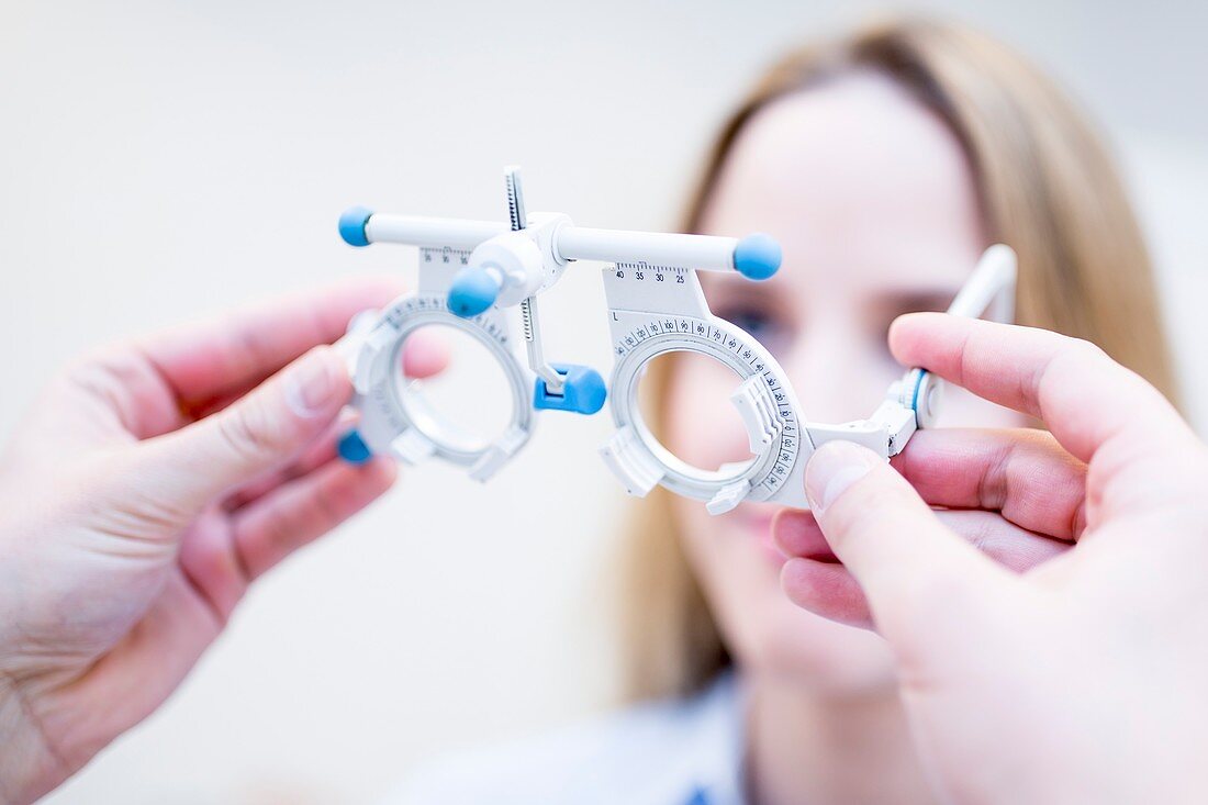 Optometrist performing eye test