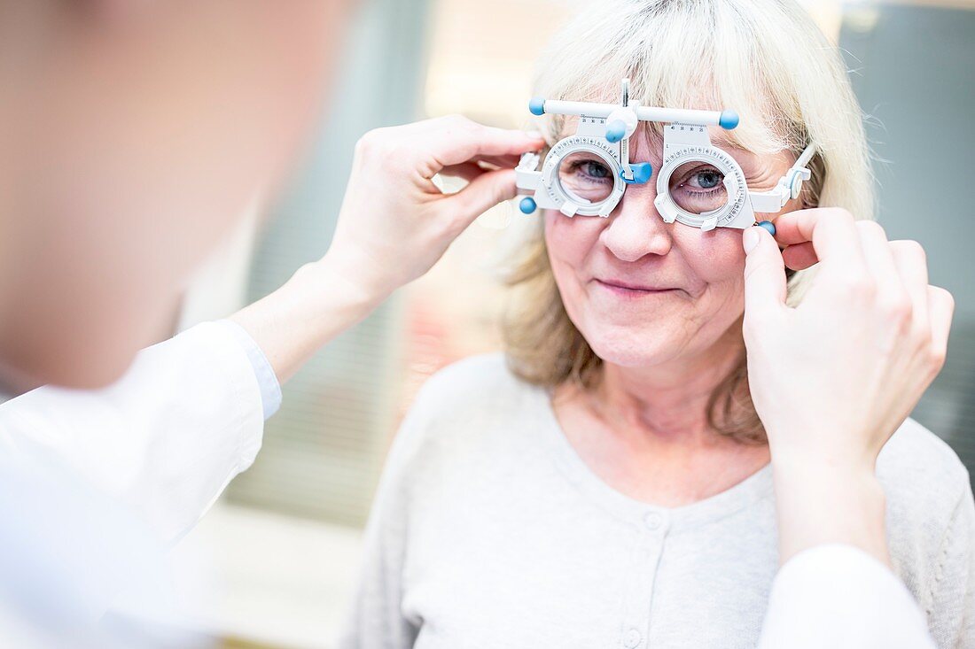 Optometrist performing eye test