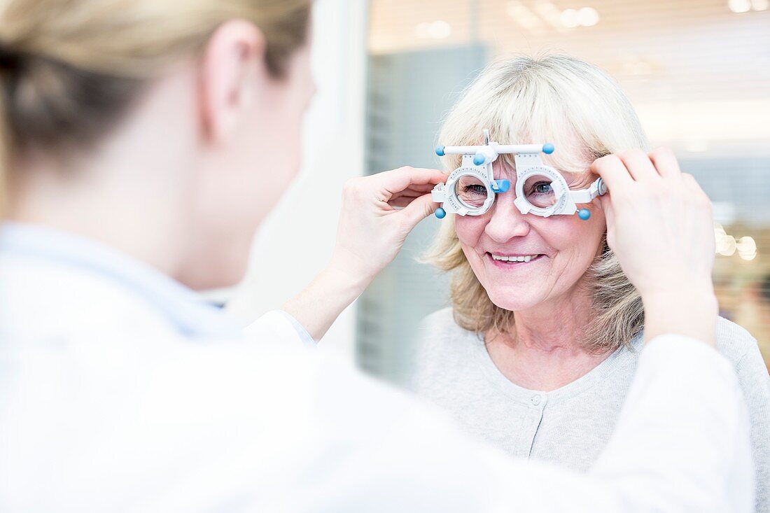 Optometrist performing eye test