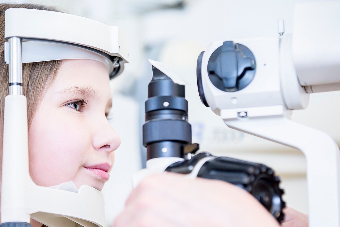 Girl having eye examination