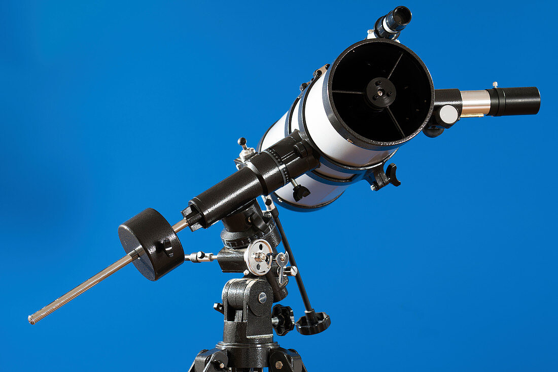 Telescope against blue background