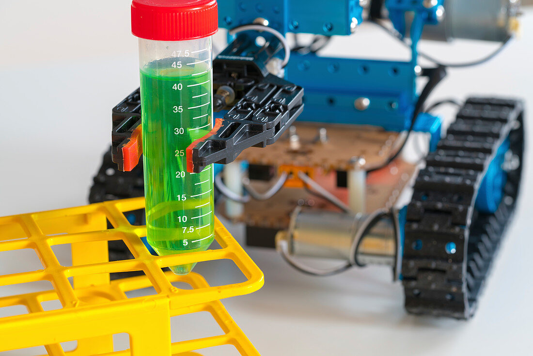 Robotic arm holding test tube