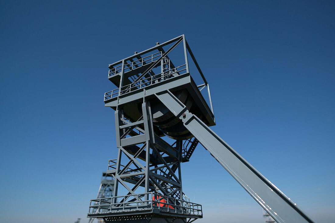 Mine shaft lift against clear blue sky
