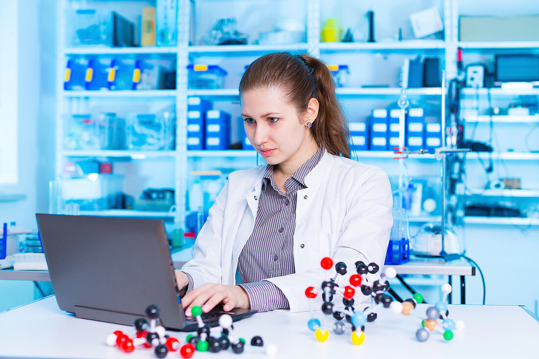 Scientist using laptop in the laboratory