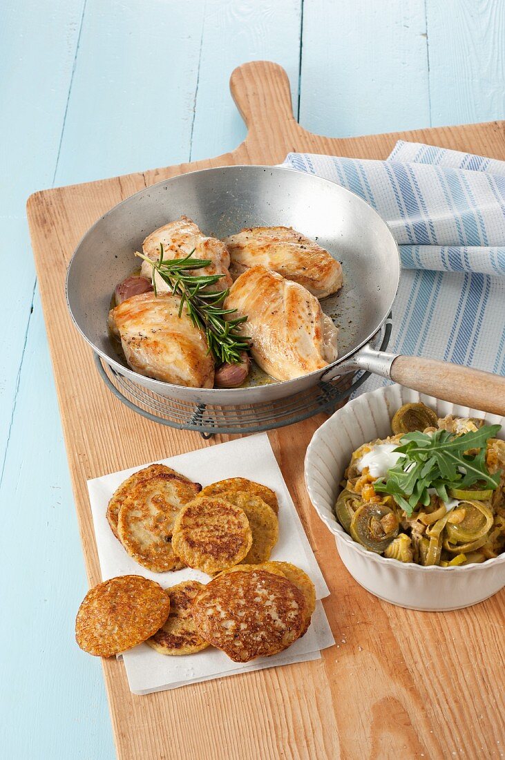 Pan fried chicken breasts with lentil pancakes and leek curry