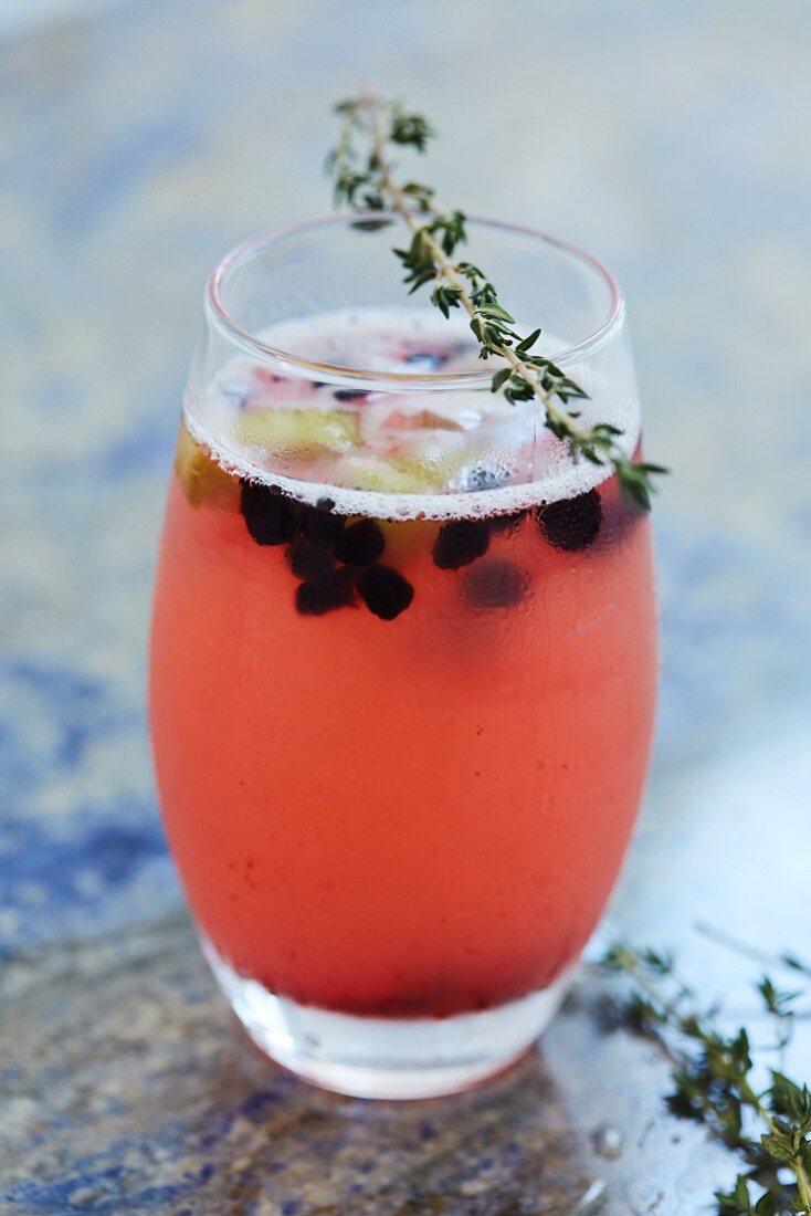 A fruity cocktail with thyme