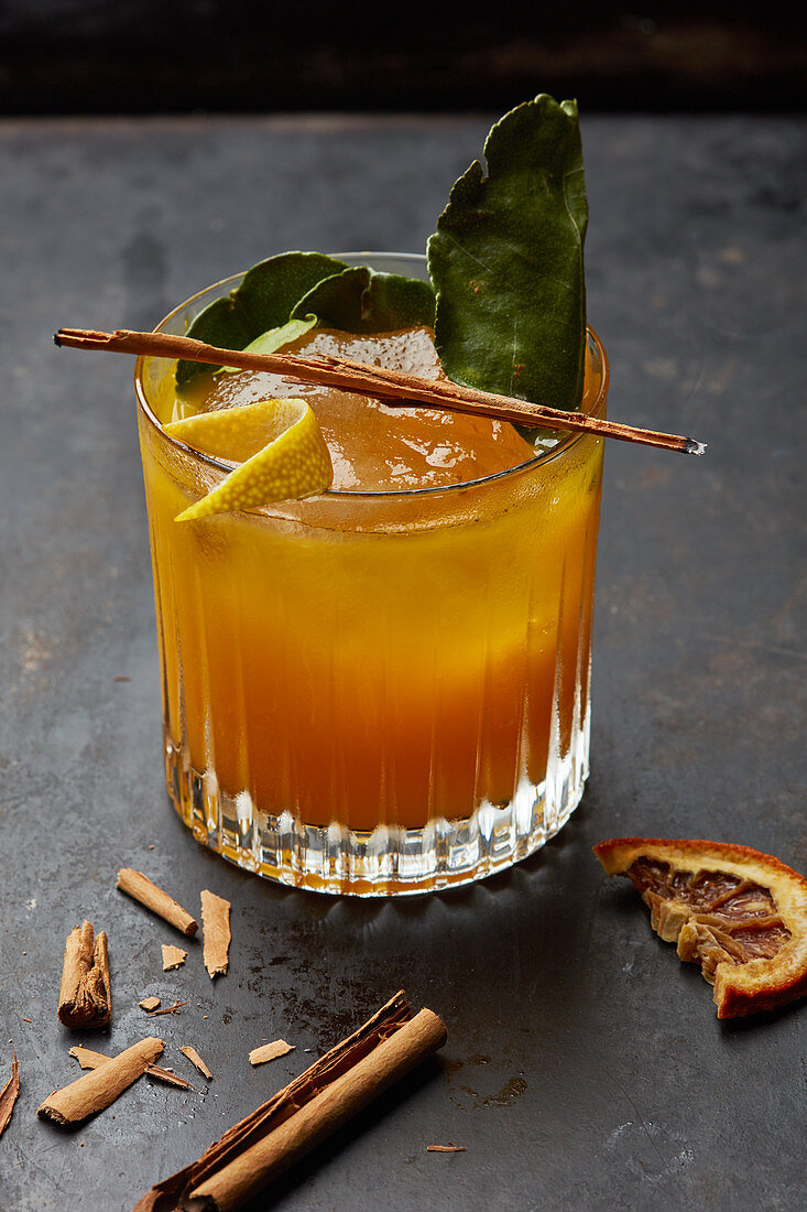 An orange drink with cinnamon