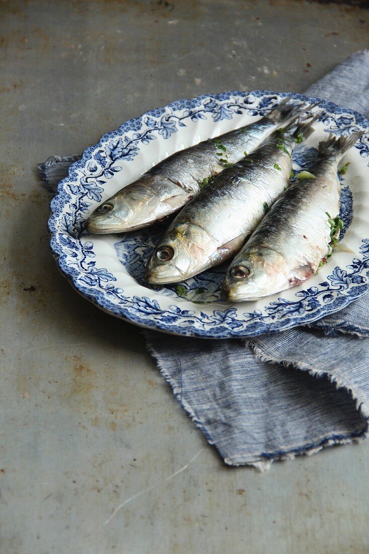 Three sardines on a plate