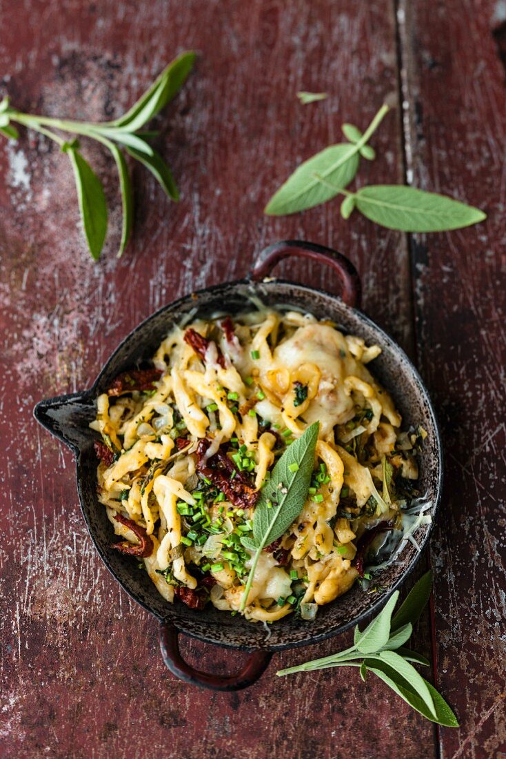 Italian style shredded cheese noodles in a pan