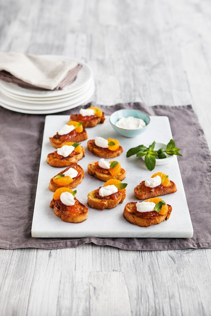 Saffron toast with tomato chutney, mandarin oranges and crème fraîche