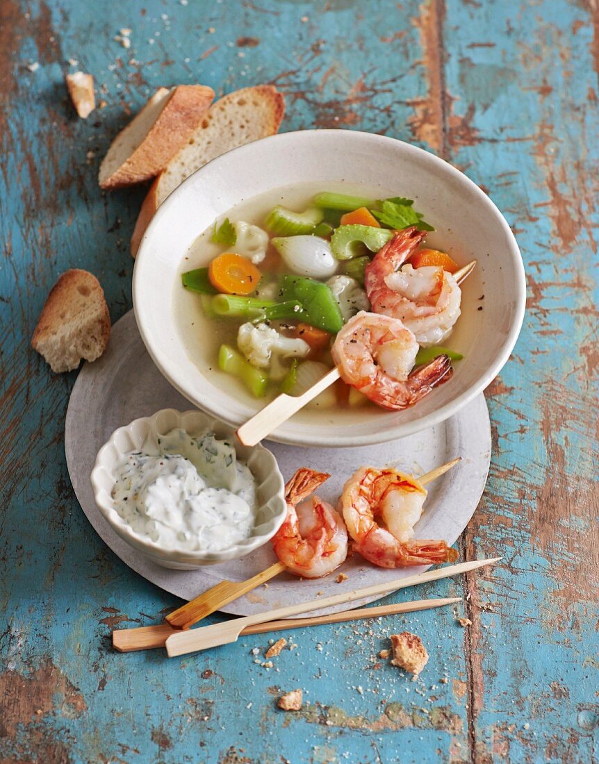 Spring vegetables with parsely sour cream and prawns