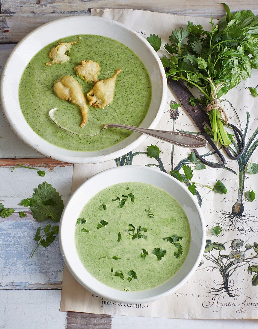 Two different kinds of herb soup: with deep-fried nettle leaves and with spinach
