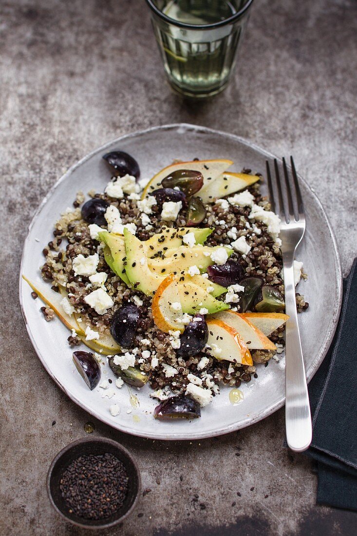 Quinoa and lentil salad with avocado, grapes and pears