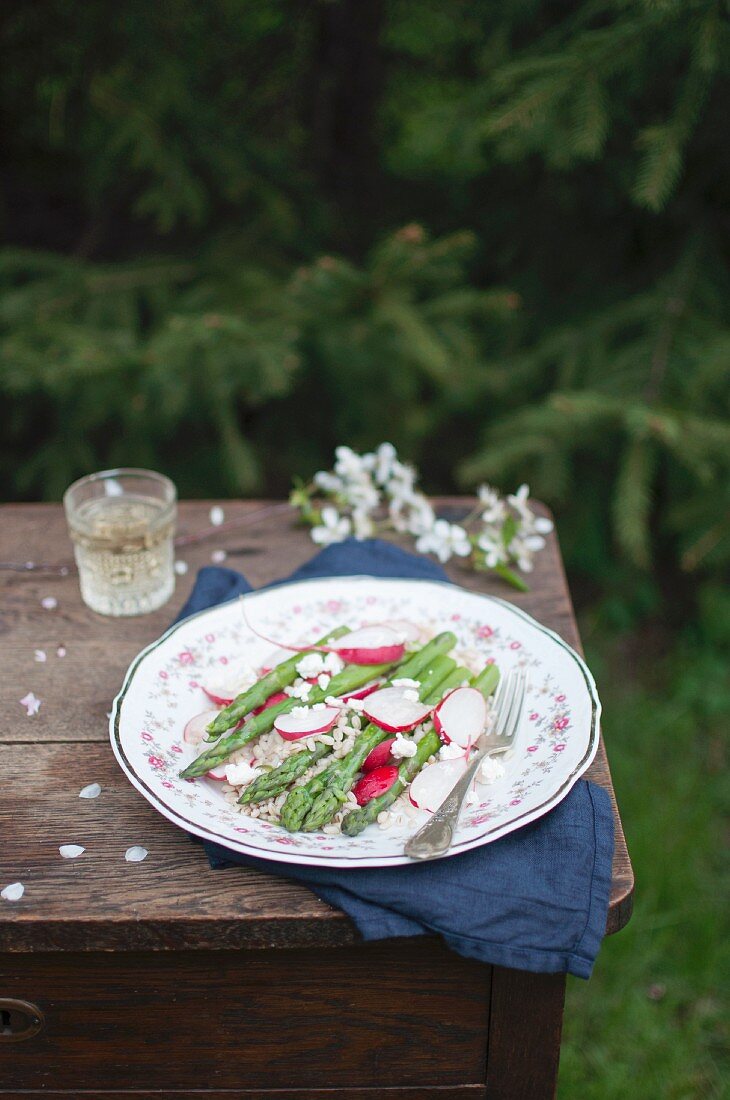 Salad made with pearl barley, green asparagus, radish and feta cheese