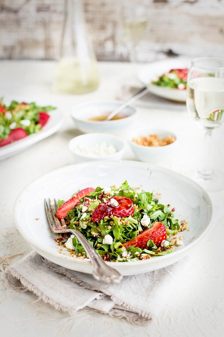 Strawberry Arugula Salad with Hibiscus Vinaigrette served with white wine