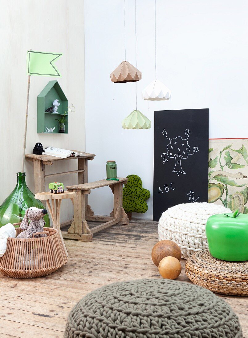 Vintage school desk and bench, blackboard and various crochet pouffes in child's bedroom