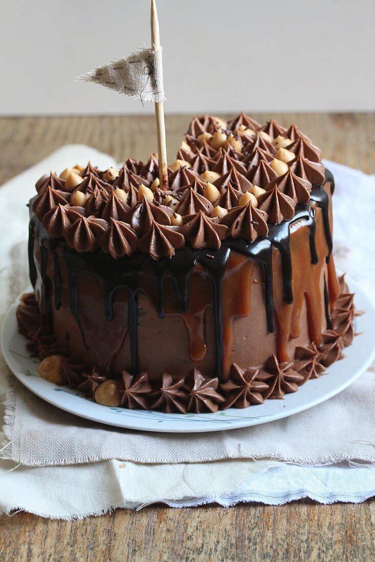 Chocolate and caramel cake with a flag