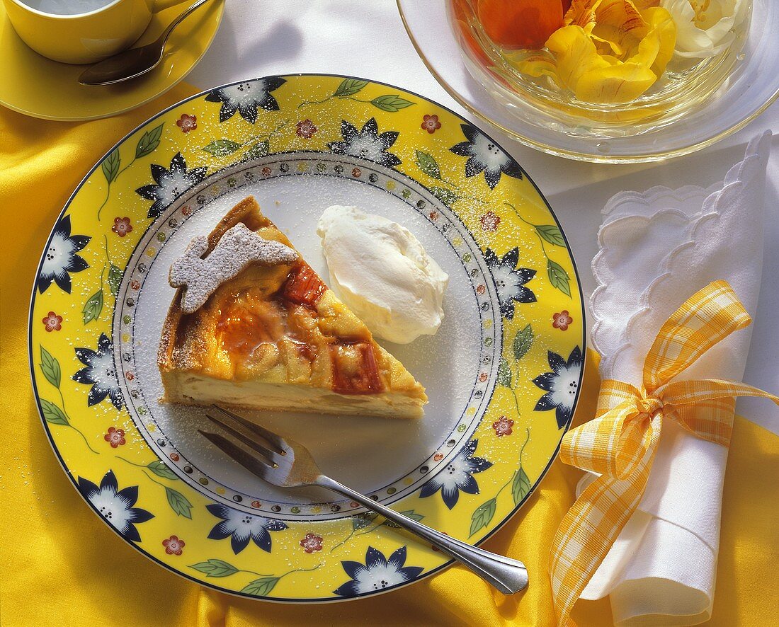 A piece of rhubarb cheesecake with whipped cream