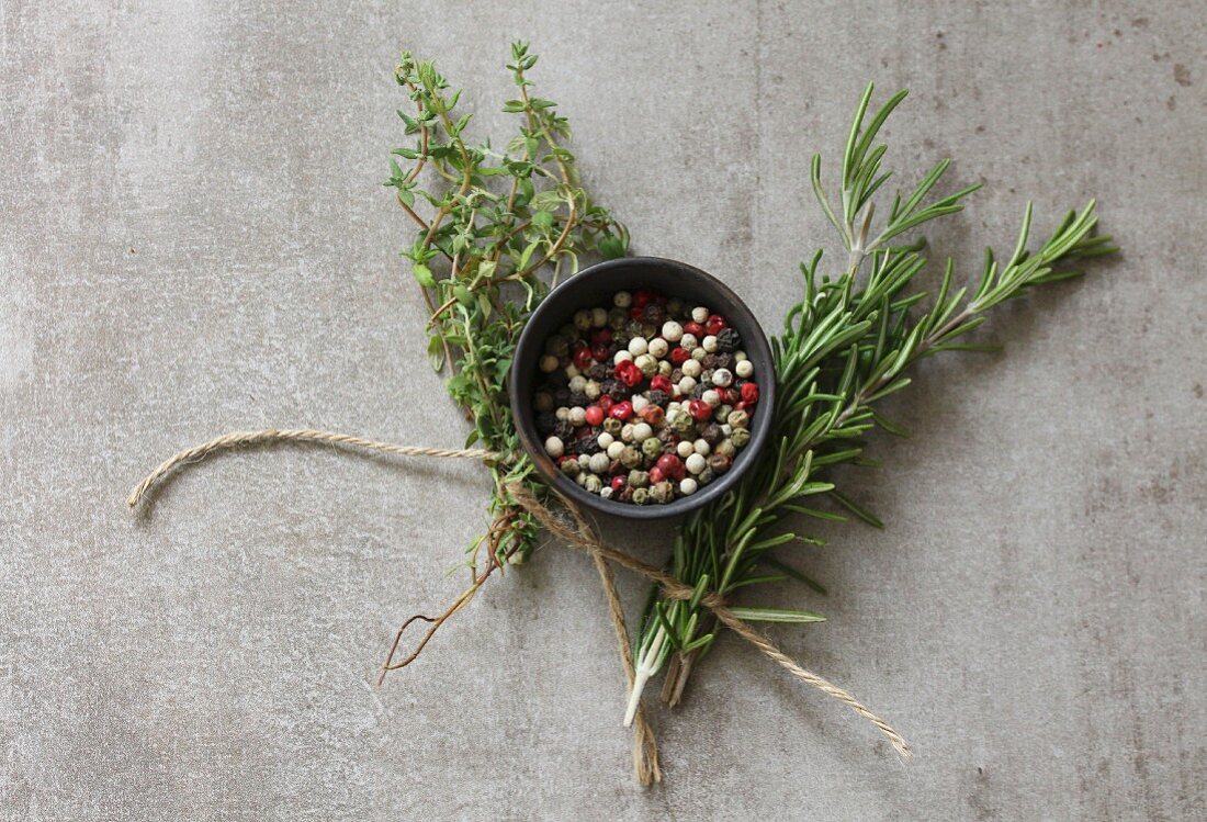 Peppercorns and fresh herbs