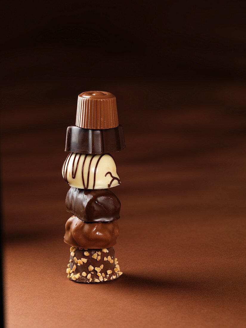 Various chocolates, stacked in a tower