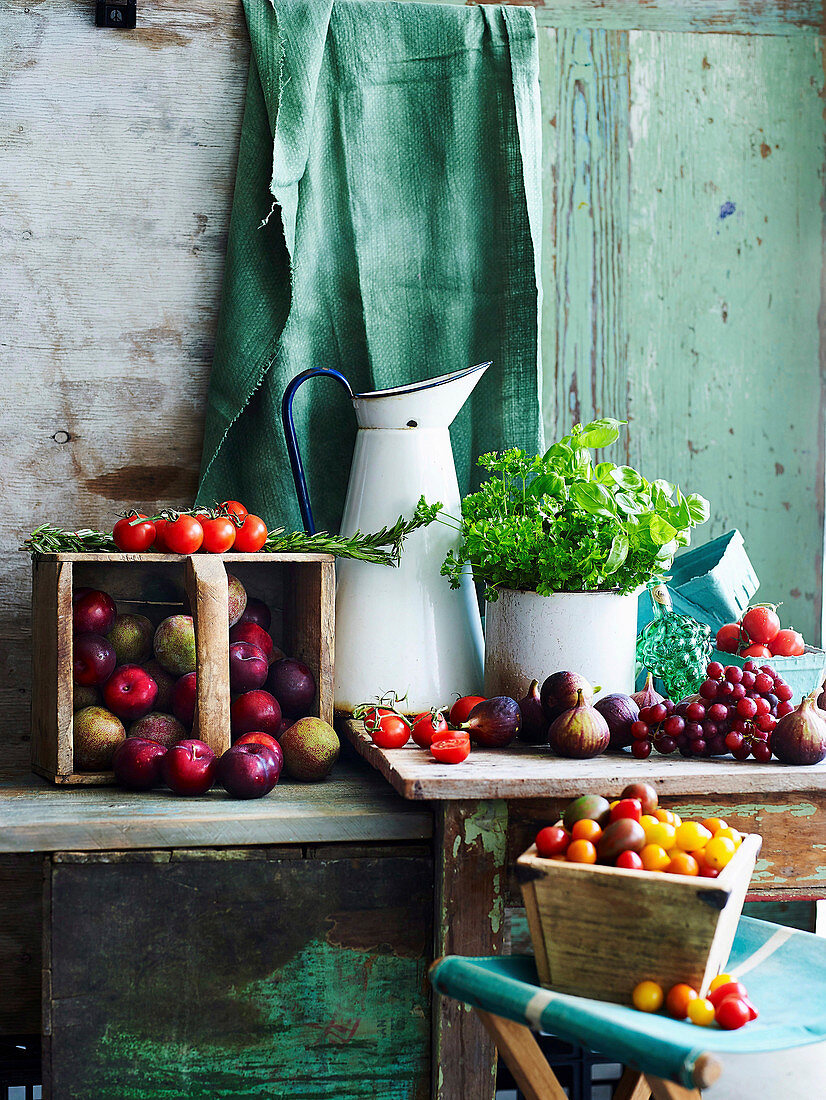 Summer harvest - tomatoes, figs, herbs grapes and plums