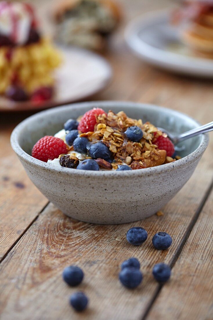 Homemade granola with fresh berries and yoghurt