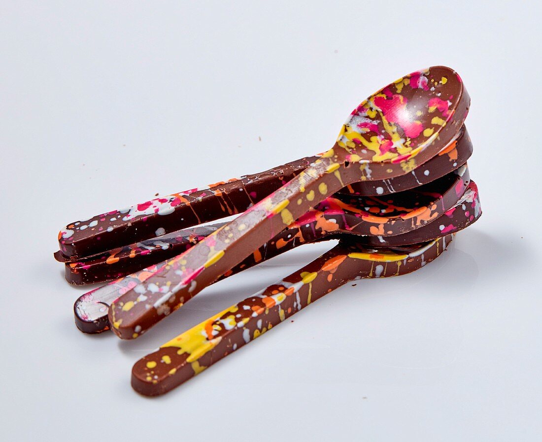 Colourful chocolate spoons in blob optics