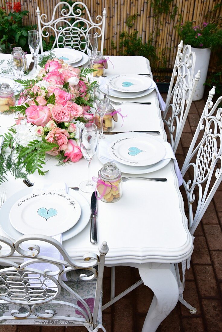 Place settings with painted hearts on a festively laid table