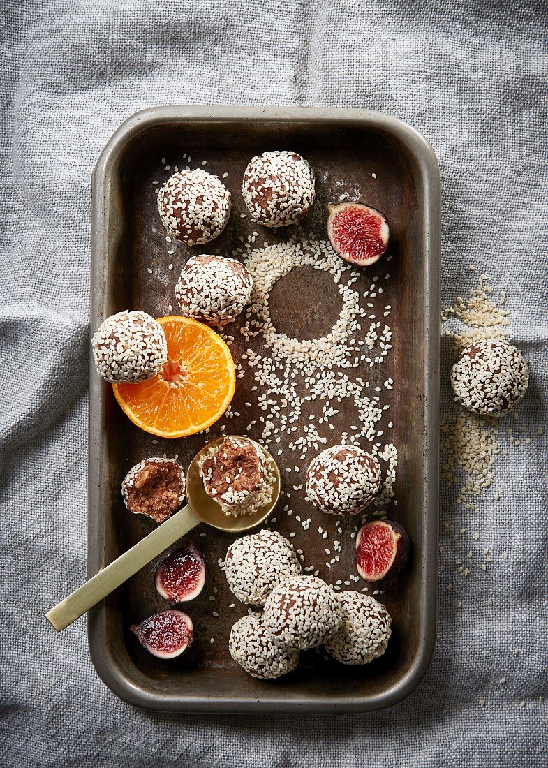 Energy balls with figs, clementines, and sesame seeds