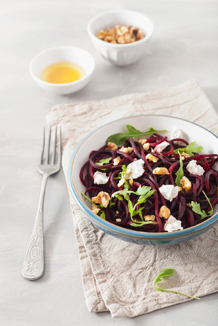 Raw spiralized beet salad with goat cheese and walnuts
