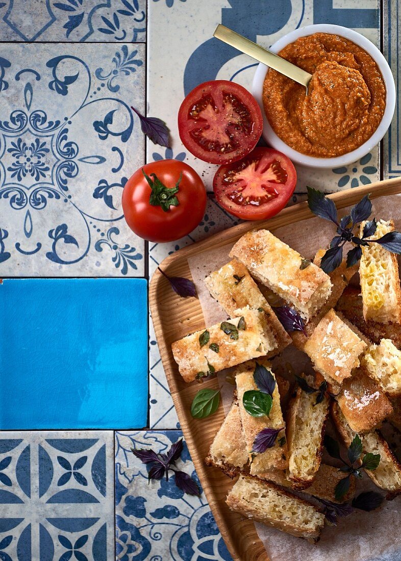 Flatbread with dried tomato houmous, lemon and oregano