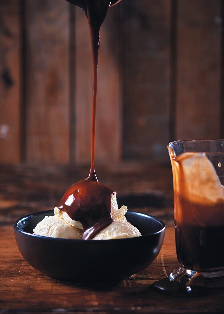 Vanilla ice cream with cherry and chocolate sauce