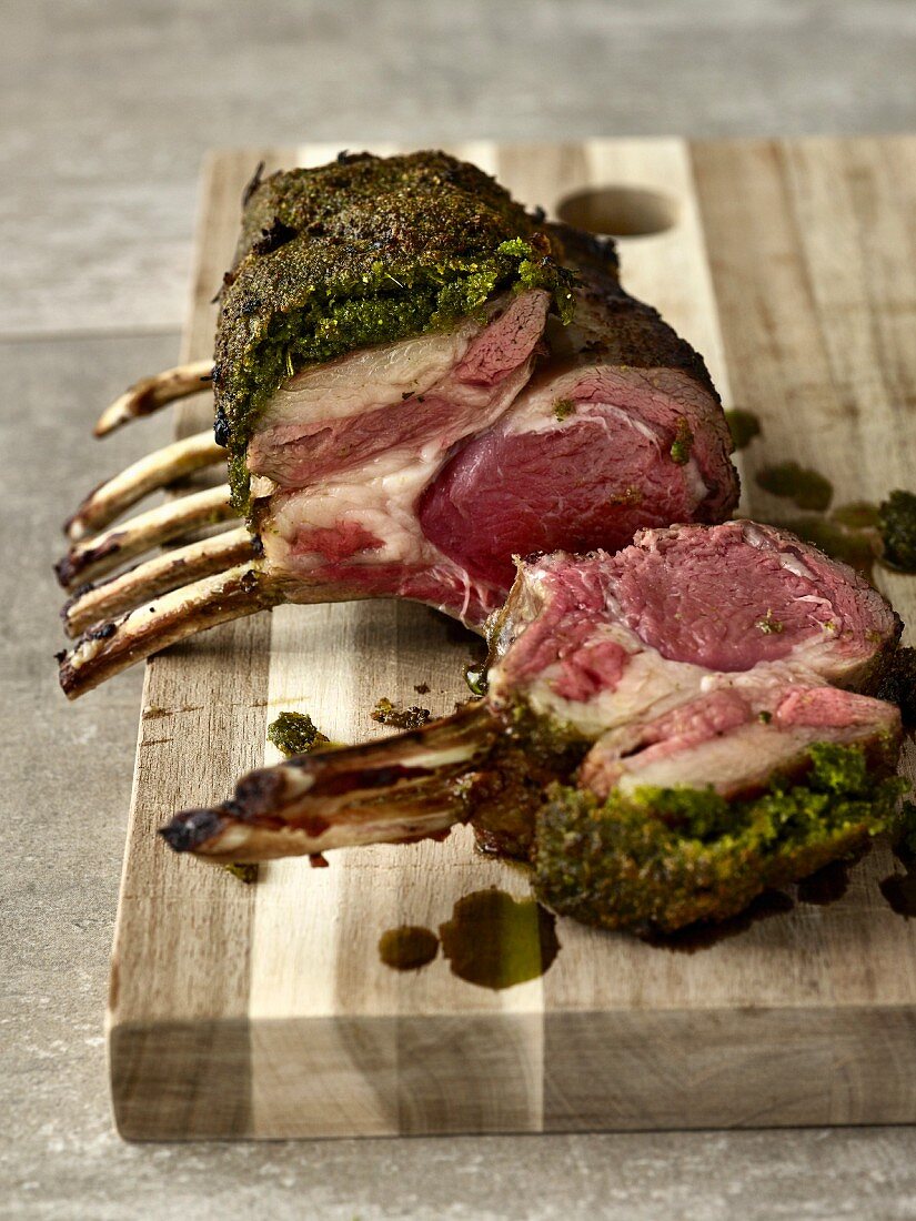 Grilled lamb chops with a herb crust, sliced