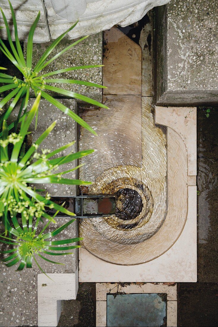 The garden at the Fondazione Querini-Stampalia with geometric shapes, water, gold and concrete in Venice, Italy