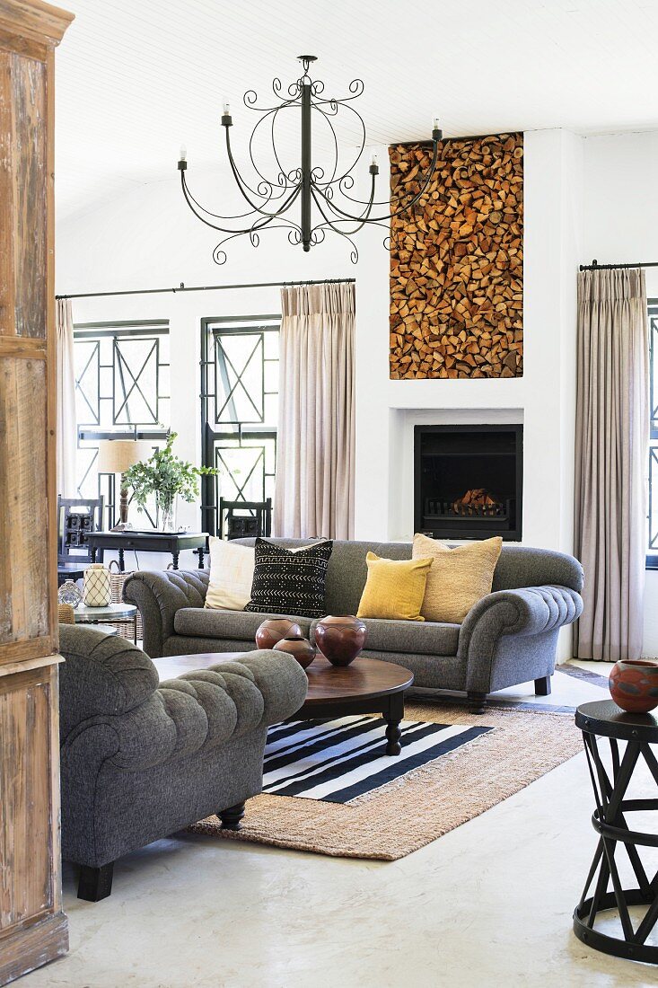 Open fireplace in classic living room in natural shades