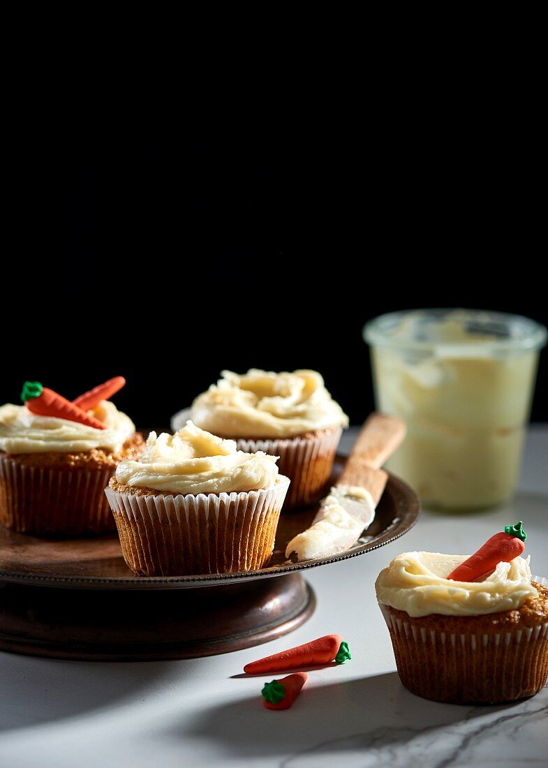 Carrot Cupcakes with Cream Cheese Frosting; On Platter