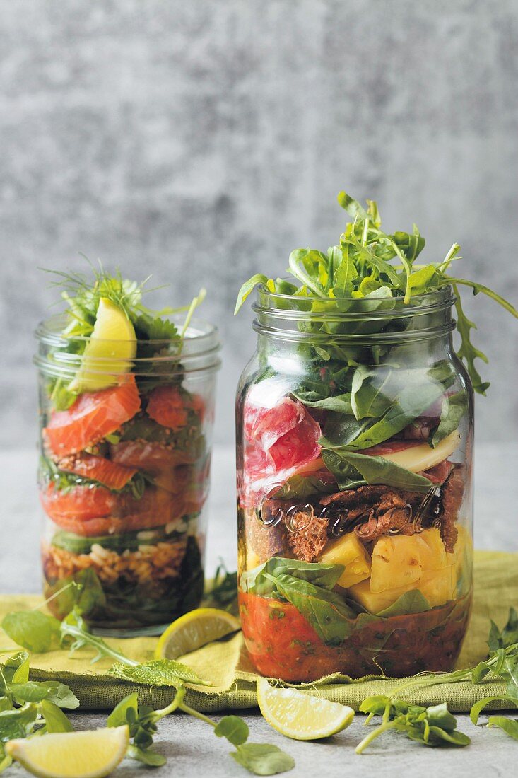 Layered salad in two glass jars