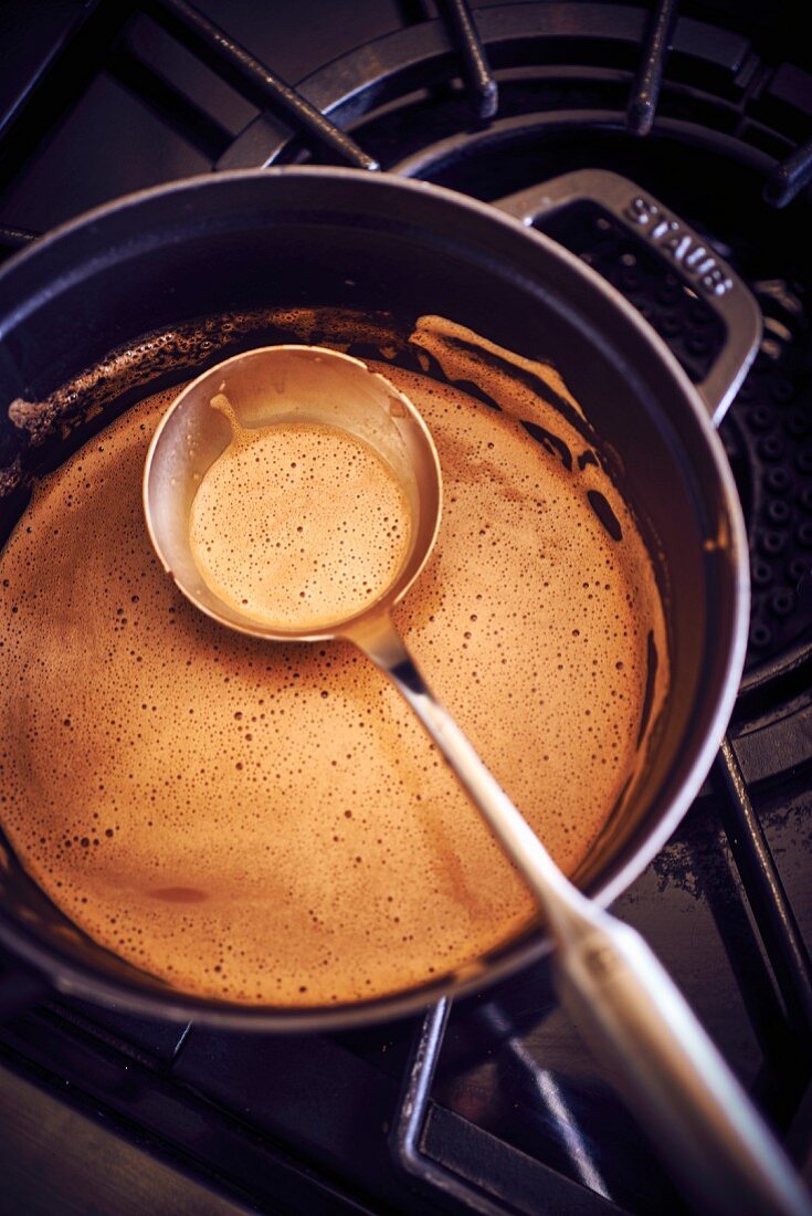 Hot chocolate in a saucepan on a stove