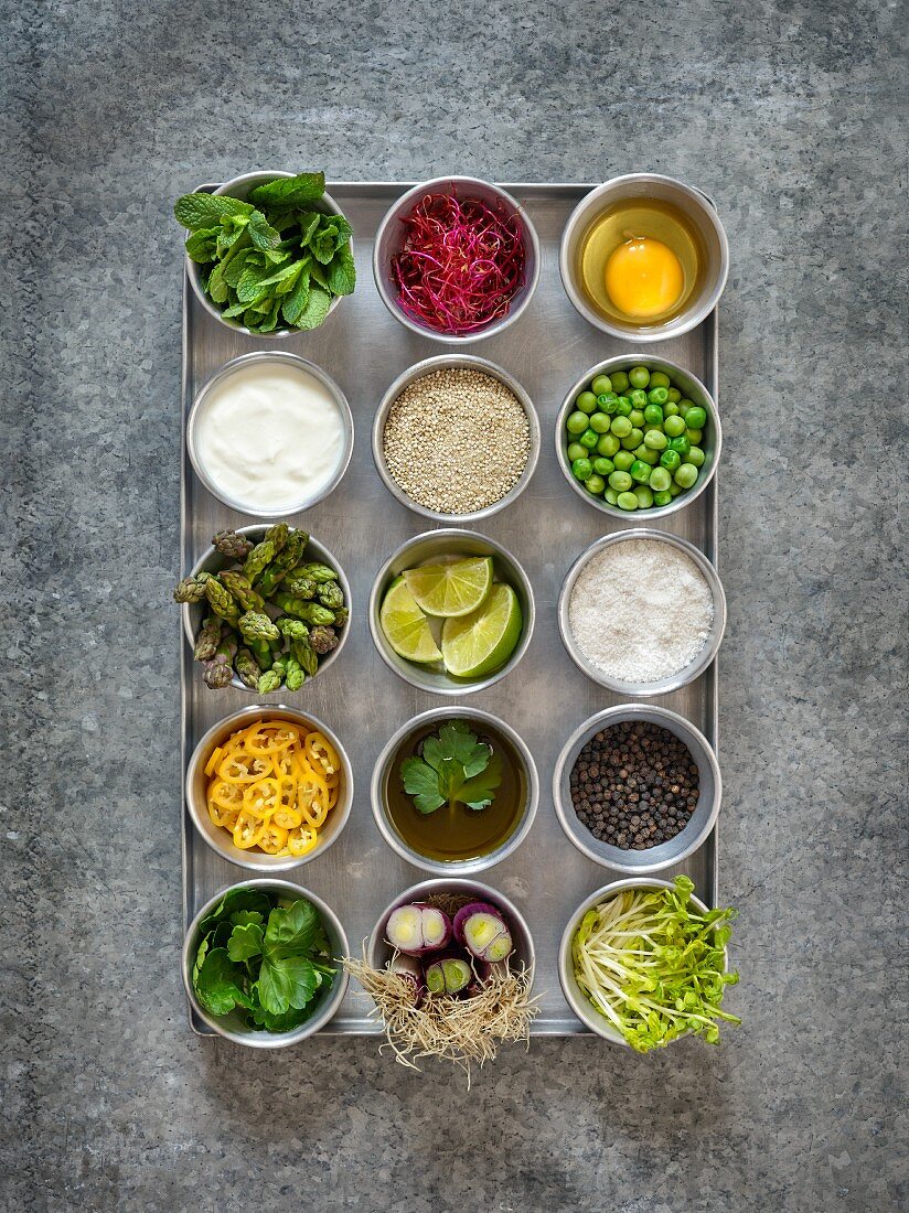 Ingredients for making quinoa burgers and muffins in small bowls